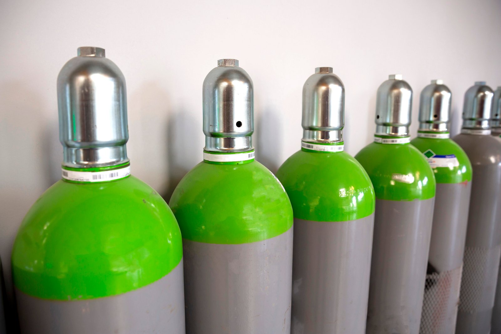 Seamless Steel Industrial Gas Cylinders. Pressurized Cylinder. Industrial stainless steel bottles in line.