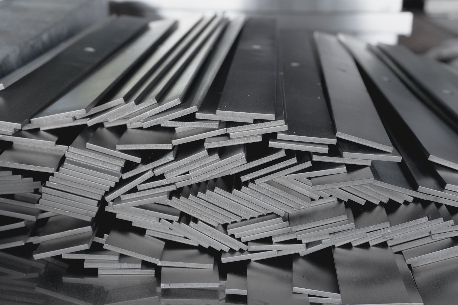 Stack of stainless steel flat bar of background.