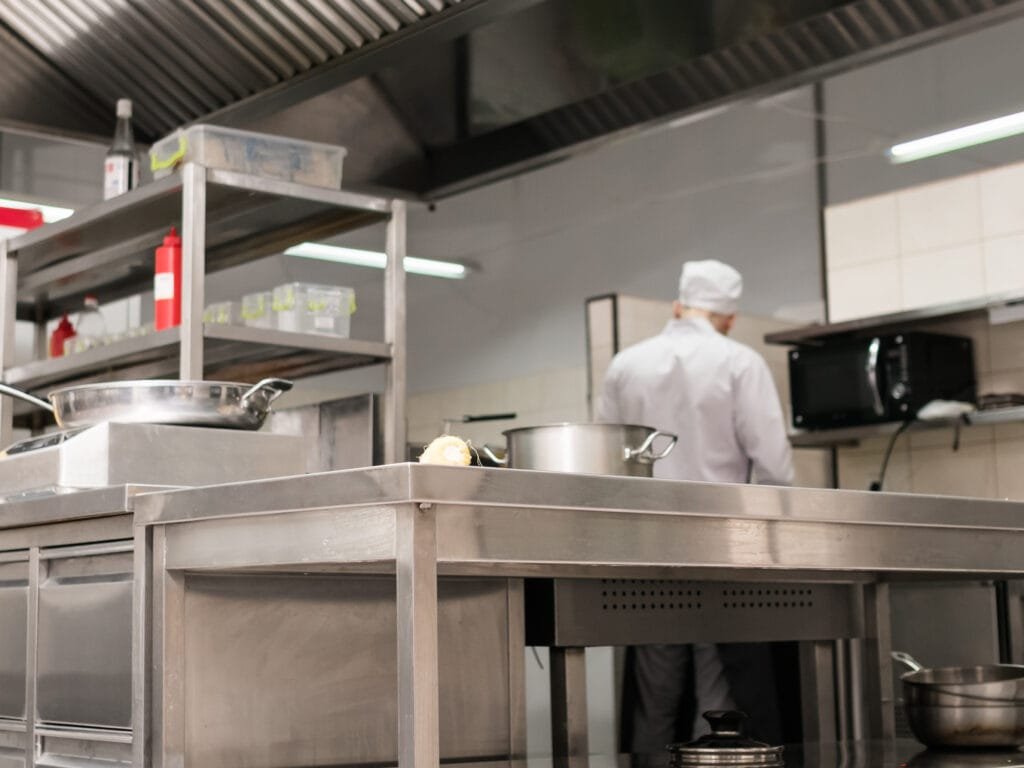 Clean and organized modern restaurant kitchen interior. Comfortable workplace for chef